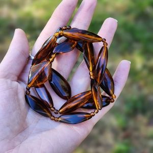 TORTOISE SHELL BEADED BRACELETS SET OF THREE, EACH HAS DIFFERENT SHAPED BEADS